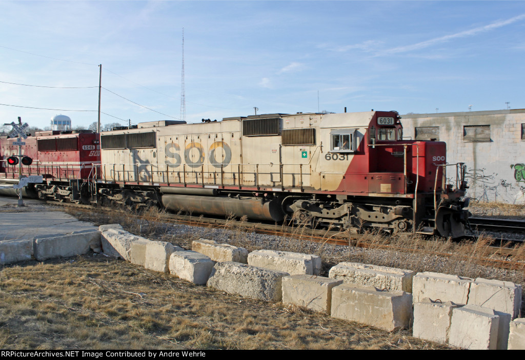 SOO 6031 heads up a quartet of unrepainted SD60s!